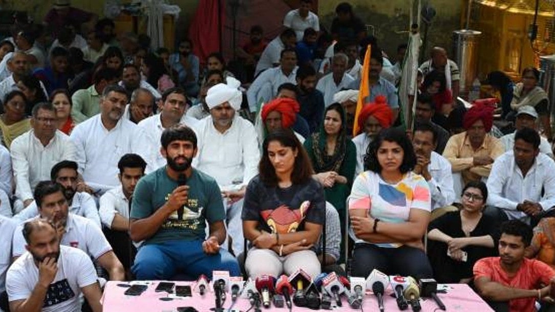 Wrestlers Bajrang Punia, Vinesh Phogat and Sakshi Malik briefing the media (photo: Getty Images)