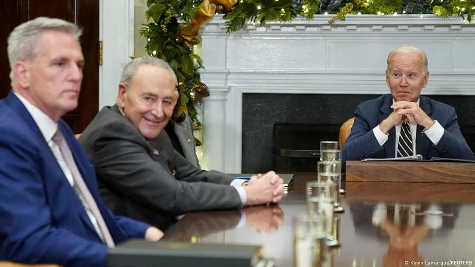 US President Joe Biden with Republican Speaker Kevin McCarthy (extreme left)