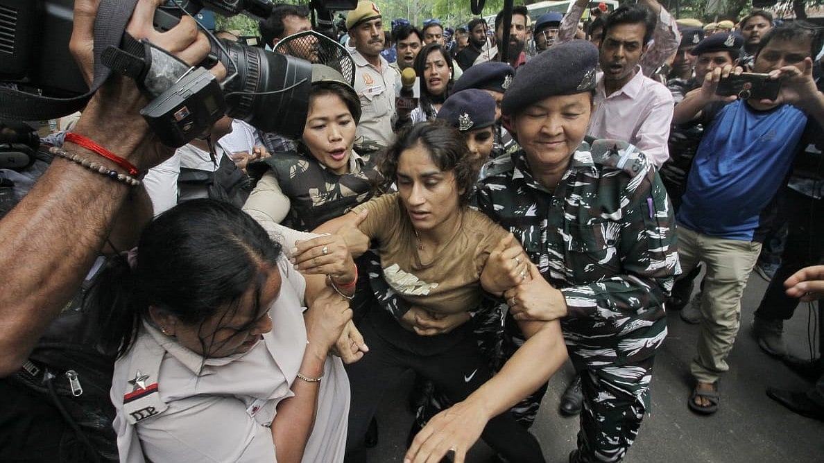 Delhi Police forcibly remove Olympian wrestler Vinesh Phogat from the Jantar Mantar protest site on Sunday, ahead of the intended peaceful march to parliament (Photo: Vipin) 