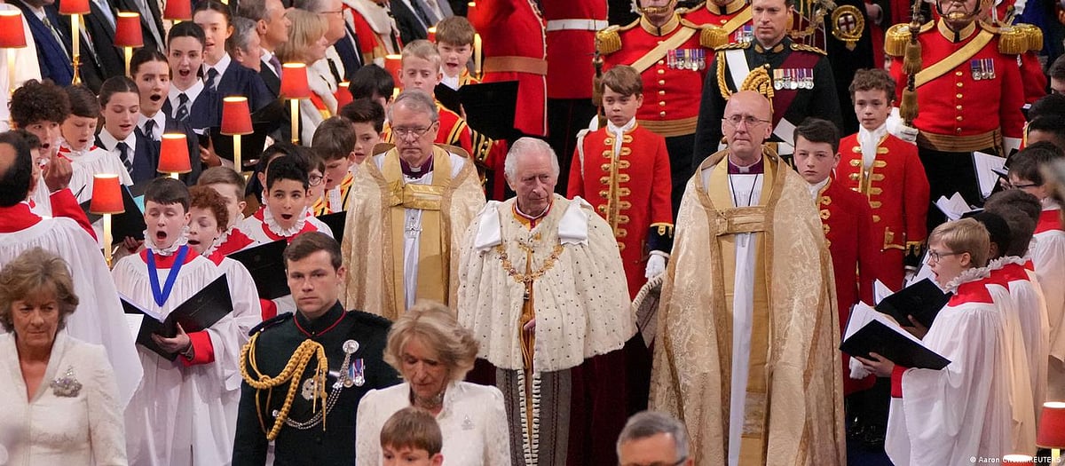King Charles III walks down the Westminster Abbey, London.