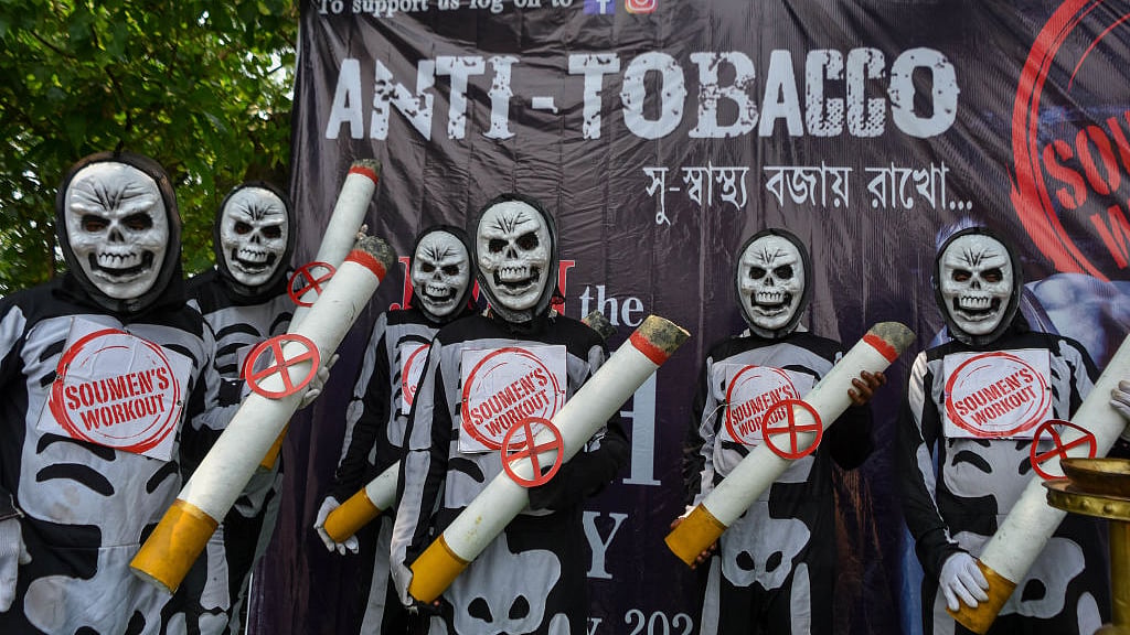 Anti-tobacco demonstrators in skeleton costumes at Kolkata on Wednesday, May 31. (All Photos: Debarchan Chatterjee/NurPhoto via Getty Images)