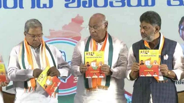 Mallikarjun Kharge, Siddaramaiah (left) and D K Shivakumar at the manifesto launch event (Photo: Screengrab/Youtube@INCIndia)
