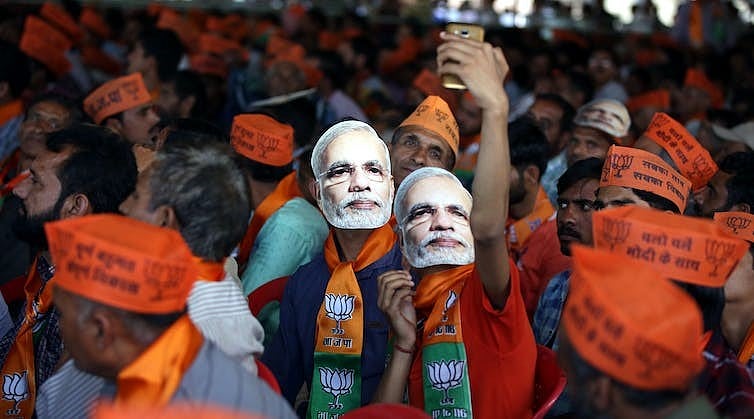 Modi fans wearing Modi masks (Photo Courtesy: EPA/SINGH)