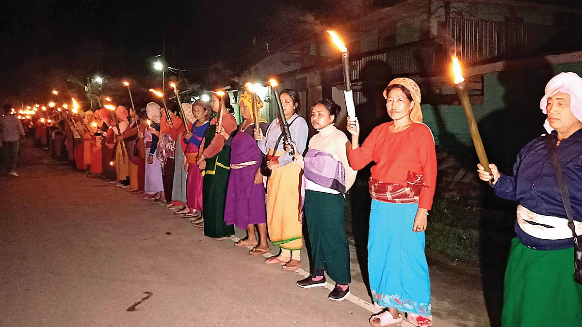 Manipur women hold a torchlight vigil, demanding peace in their strife-torn state (photo: Getty Images)