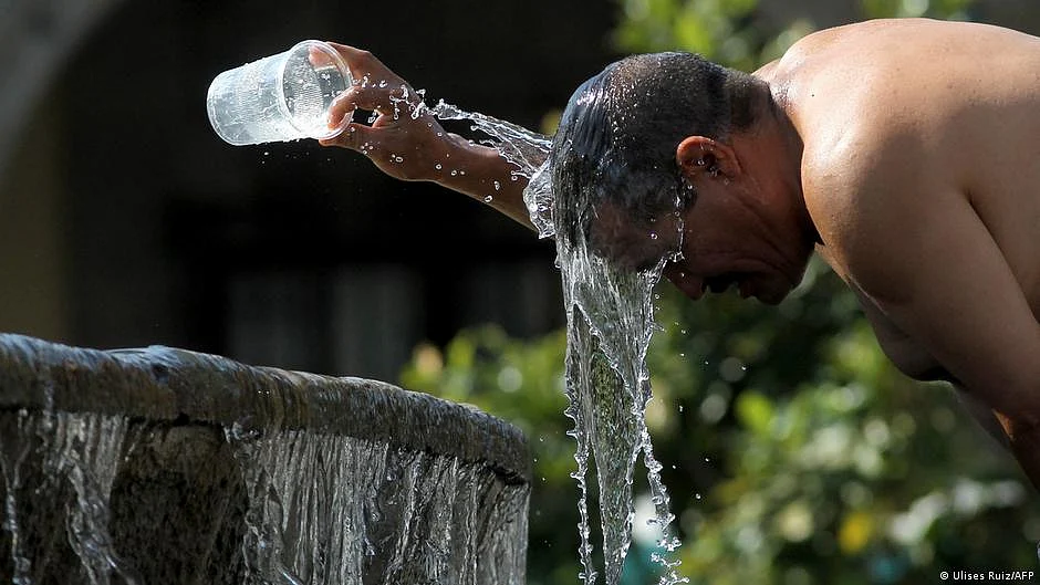 Representative image of a man pouring cold water on him due to heat exhaustion (Photo: National Herald archives)