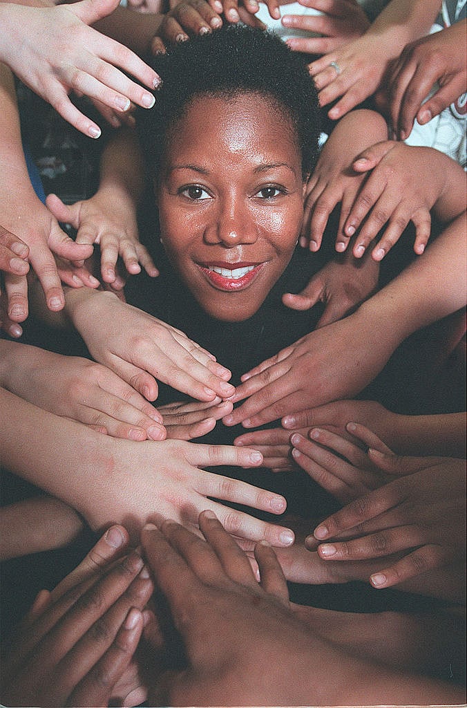 Ruby Bridges is framed with children's hands at Donwood Park School in Scarborough (photo: Getty Images)