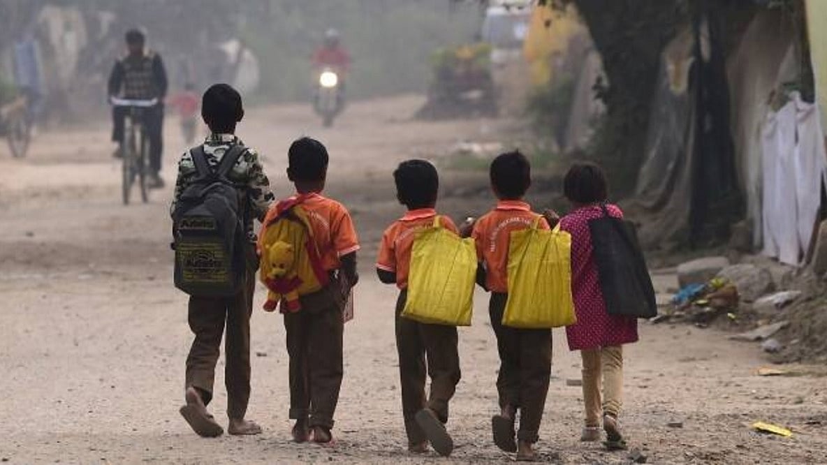 Four children with their backs turned (photo courtesy PTI)