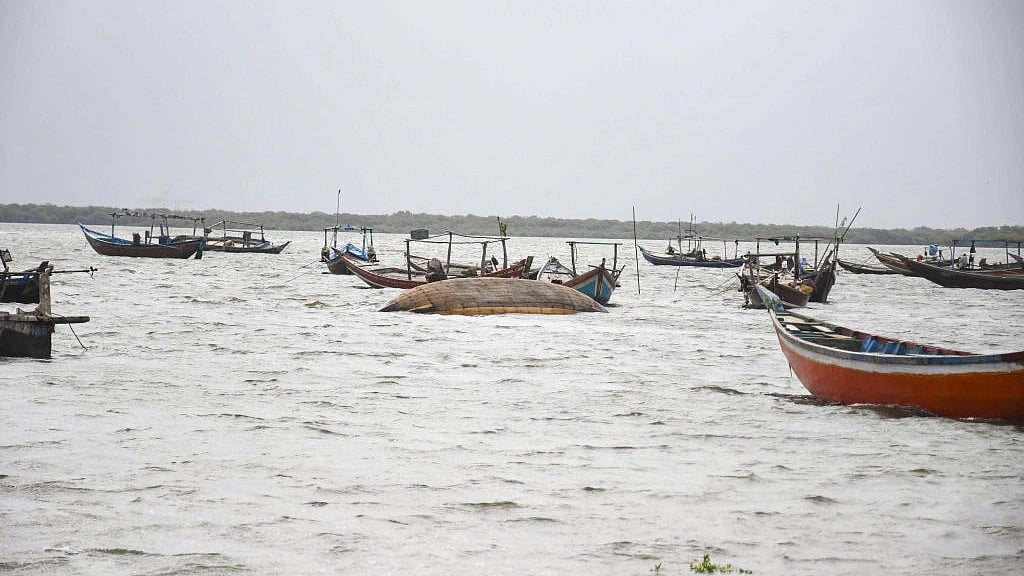 Boats are seen as Pakistani flood victims trying to cross sea water due to Cyclone Biparjoy approaching to the coastal area in Karachi, Pakistan on June 14, 2023. (all photos: Sabir Mazhar/Anadolu Agency via Getty Images)