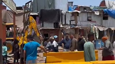 Bulldozer raising Shiv Sena's brunch (photo courtesy: IANS) 
