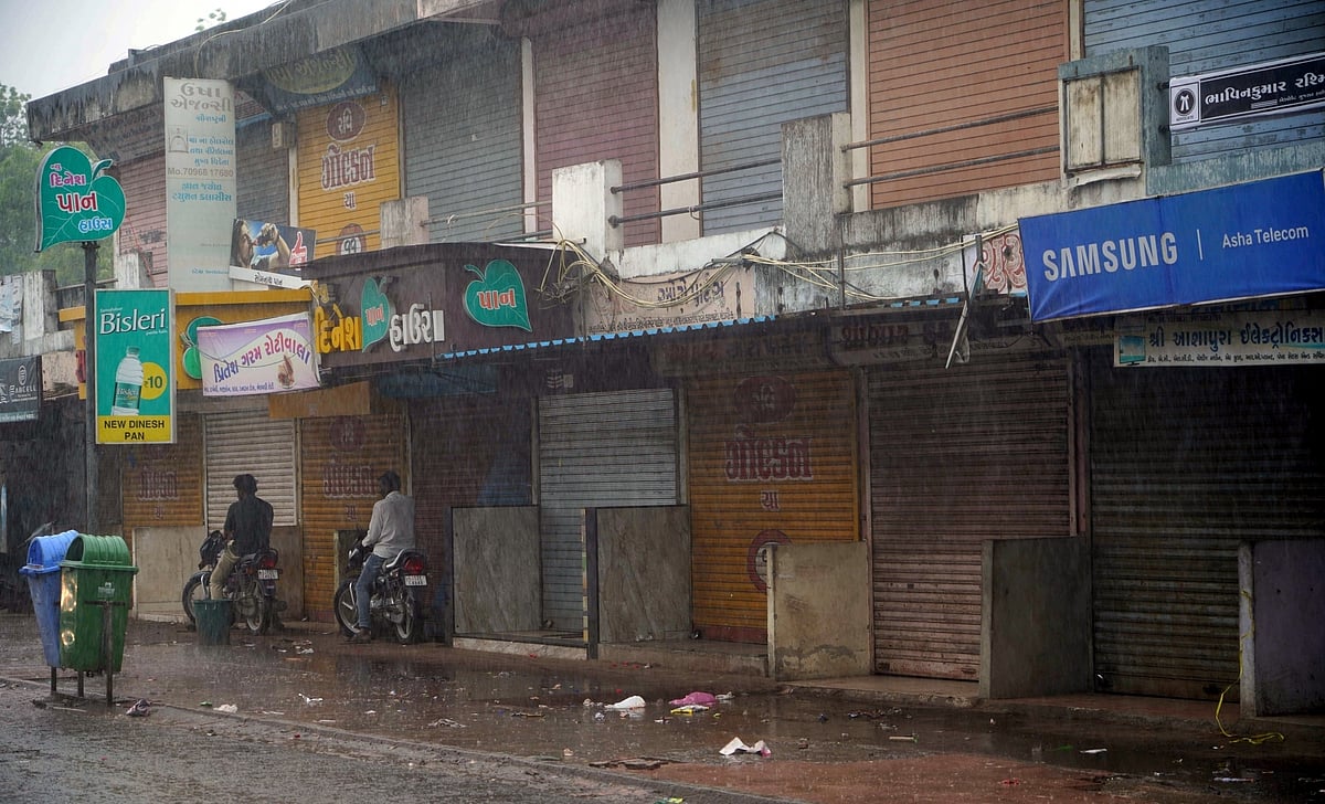 Heavy rain lashes as shops remain closed as part of precautionary measures ahead of the landfall of Cyclone Biparjoy, at Mandvi in Kutch district, on Thursday, June 15, 2023. (photo: IANS)