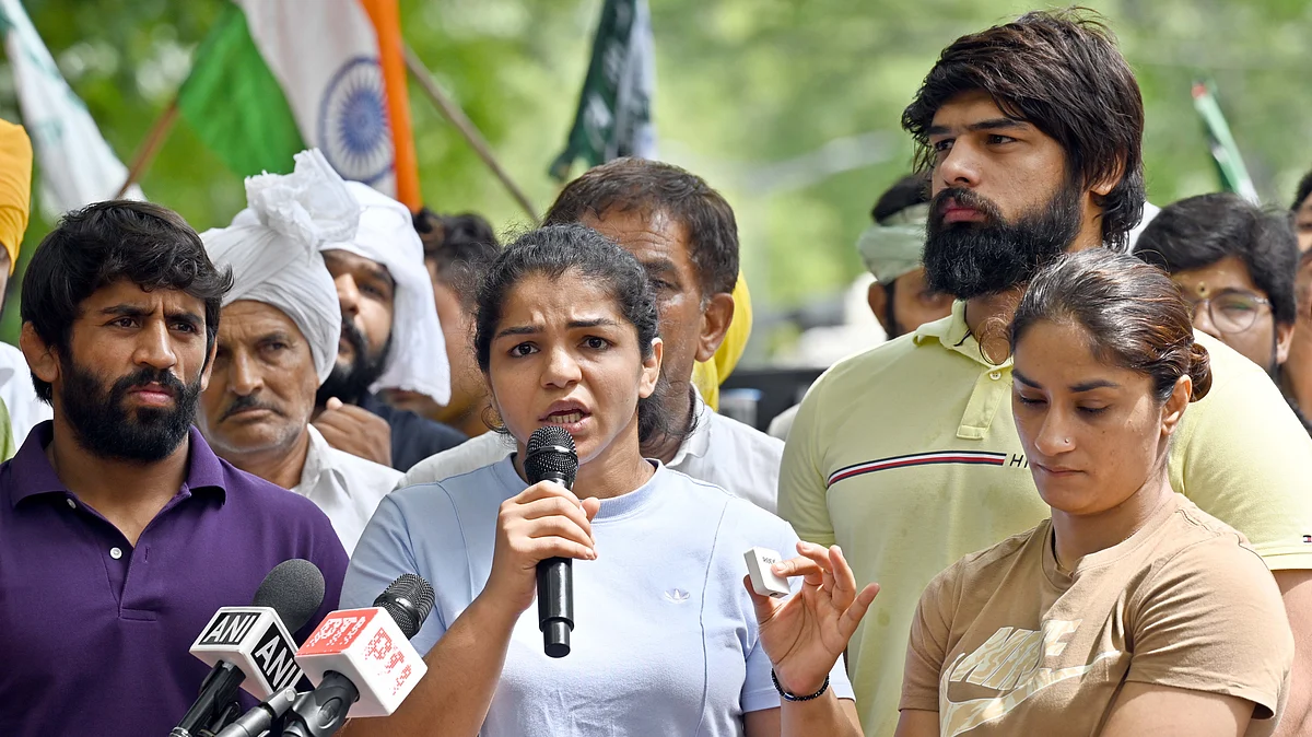 Wrestlers Vinesh Phogat, Sakshi Malik and Bajrang Punia speak with the media during their protest against Wrestling Federation of India (WFI) chief Brij Bhushan Sharan Singh at Jantar Mantar. (photo: getty images)