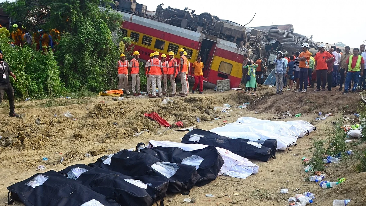 Bodies pulled from the wreckage of the Bengaluru–Howrah superfast express and the Coromandel Express set aside in bags at the accident site near Bahanaga Bazar station in Balasore district of Odisha (photo: Biswanath Swain/IANS)