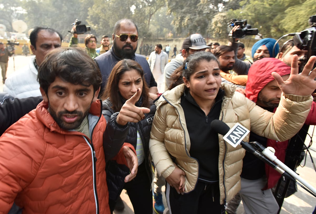 Wrestlers Vinesh Phogat, Sakshi Malik, and Bajrang Punia during the protest at Jantar Mantar on January 19, 2023, in New Delhi. (photo: Getty Images)