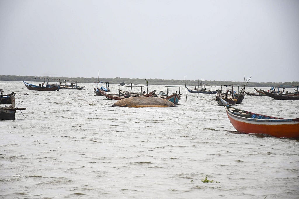 Boats are seen as Pakistani flood victims trying to cross sea water due to Cyclone Biparjoy approaching to the coastal area in Karachi, Pakistan on June 14, 2023. (all photos: Sabir Mazhar/Anadolu Agency via Getty Images)