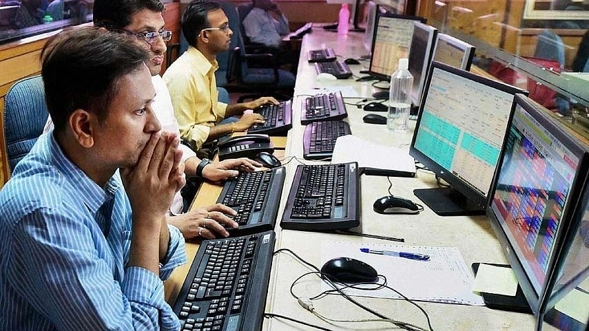 File photo of stock market traders at work (Photo: NH File Photo)