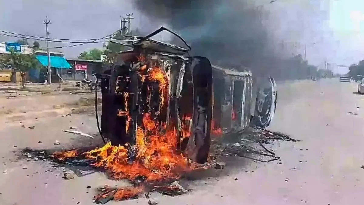 A burning car in Nuh communal riots (Photo: IANS)