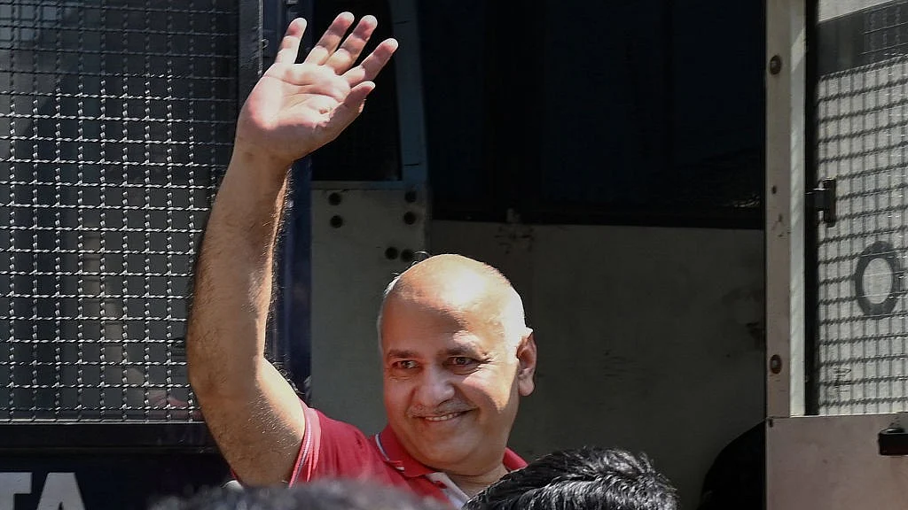Manish Sisodia coming out of a police van (photo: IANS)