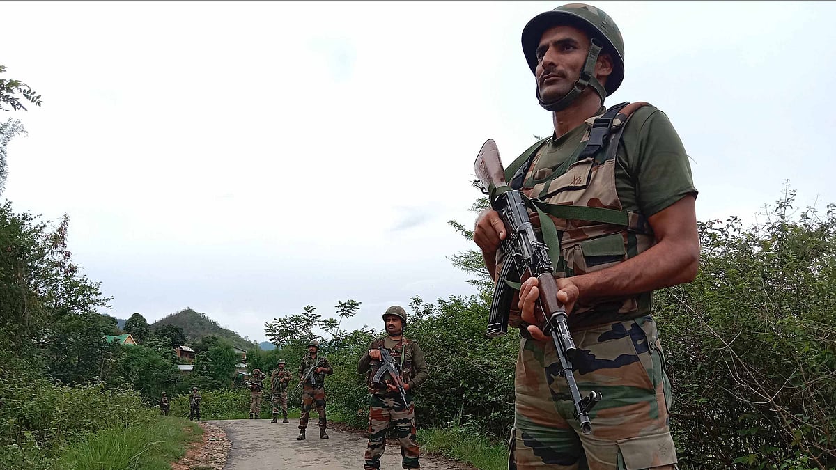 Indian Army officials patrol in the violence-hit area in India's north-eastern state of Manipur on 16 June 2023 (photo: Getty Images)
