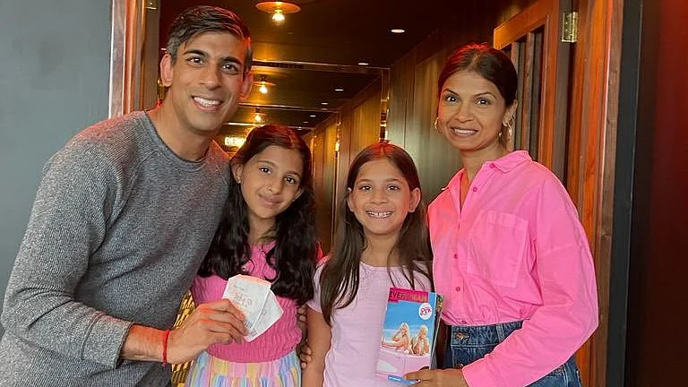 UK PM Rishi Sunak with his wife Akshata Murty and their two daughters catching the 'Barbie' show. (photo courtesy: @RishiSunak/Twitter)
