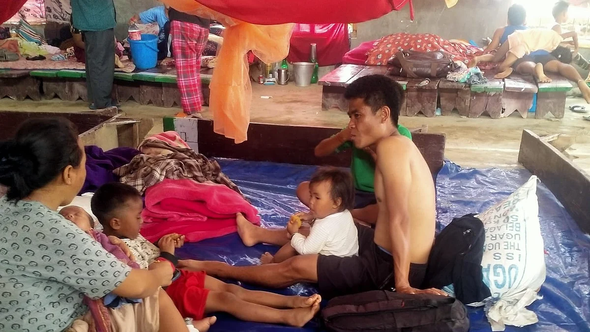 A tribal family sits in a makeshift relief camp in Manipur (Photo courtesy: Rural Women Upliftment Society (RWUS) Churachandpur)