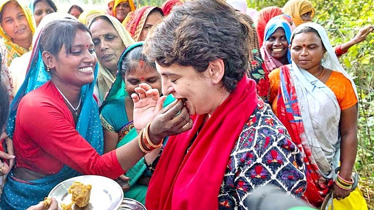 Priyanka Gandhi being given a treat by local women farmers in UP's Barabanki, October 2021 (Photo Courtesy ANI)
