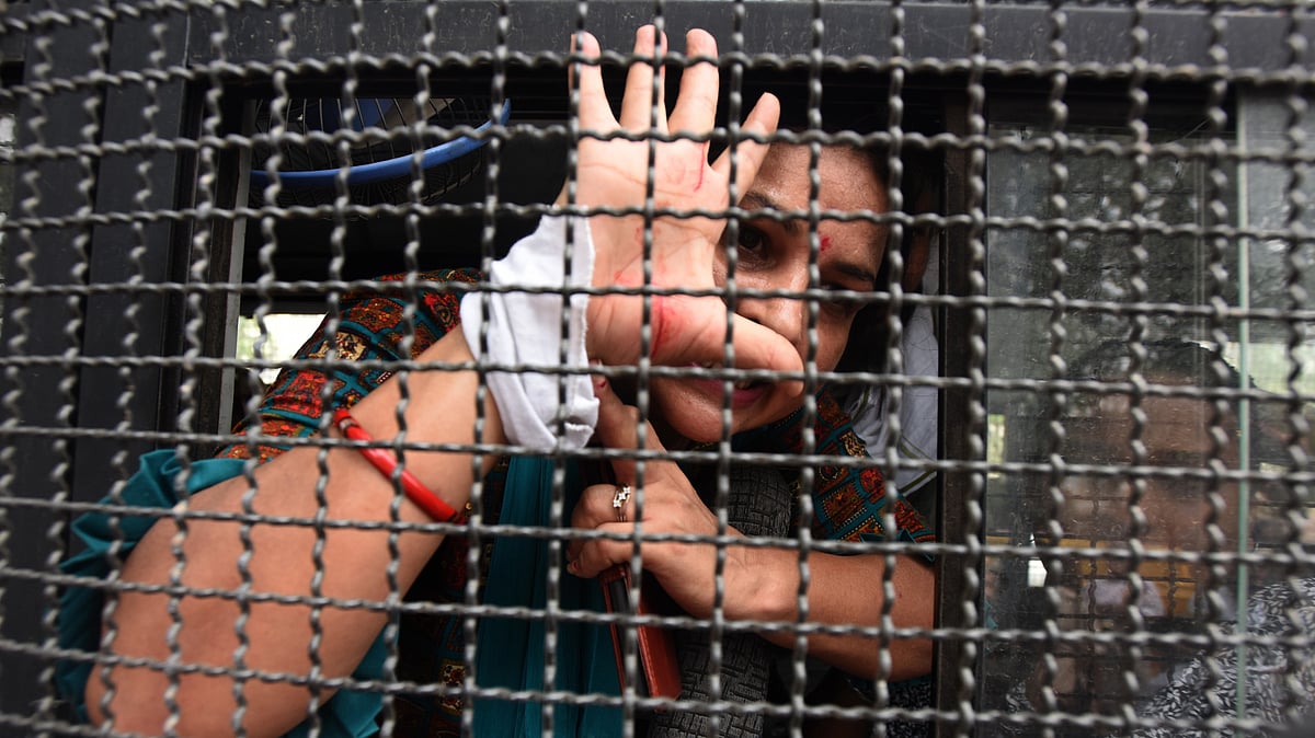 An effective gag can be transparent. Indian Youth Congress activist detained behind the security mesh for protesting against the Manipur crisis and demanding the CM's resignation at Shastri Bhavan, New Delhi, on 3 July 2023 (photo: Getty Images)