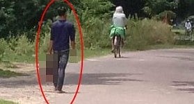 A person spotted walking with a severed head