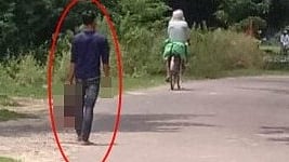 A person spotted walking with a severed head
