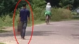A person spotted walking with a severed head