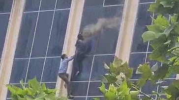 People jumping off the buidling (Photo: IANS)