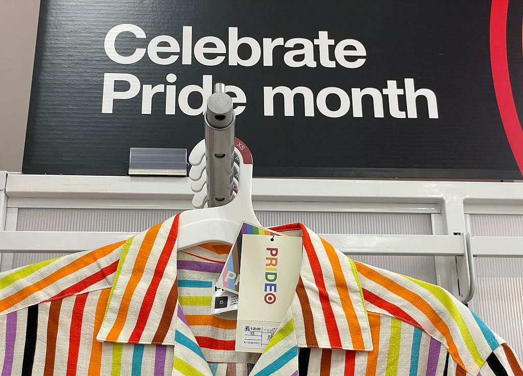 A rainbow shirt is displayed in a Pride Month merchandise display at a Target store on May 31, 2023 in San Francisco, California. Target has pulled some of its Pride Month merchandise from stores or have moved the seasonal displays to lesser seen areas of their stores to avoid conservative backlash that has threatened workers’ safety.