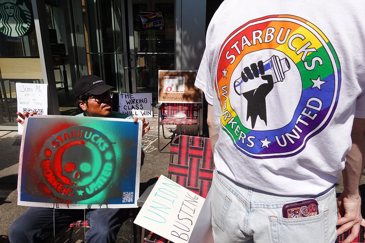 People picket in front of a Starbucks store in the Greektown neighborhood on June 24, 2023 in Chicago, Illinois. The event, organized by the Starbucks Workers Union, was one of many pickets held nationwide after the coffee giant and the union clashed over claims that the company banned Pride month decorations.