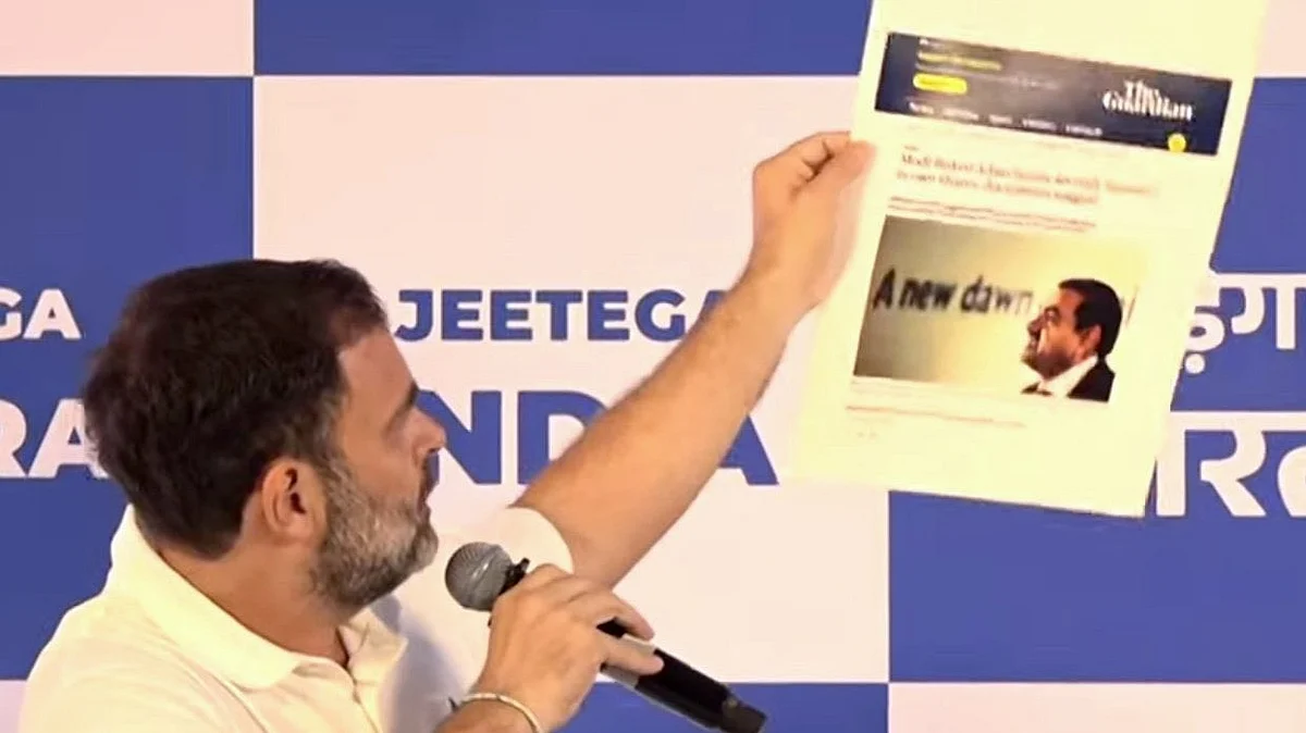 Congress leader and MP Rahul Gandhi holding the copy of a news paper report during his press briefing on the Adani issue in Mumbai on Thursday, 31 August 2023 (photo courtesy: @INCIndia/Twitter) 