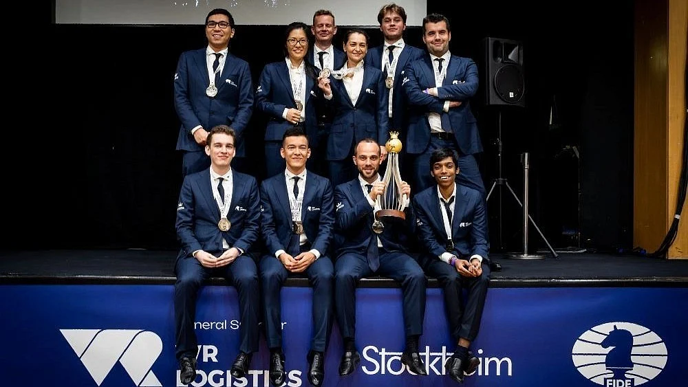 In elite company: Pragg (sitting, extreme right) with other members of WR Chess team, which won the World Rapids on 29 August (photo: FIDE)