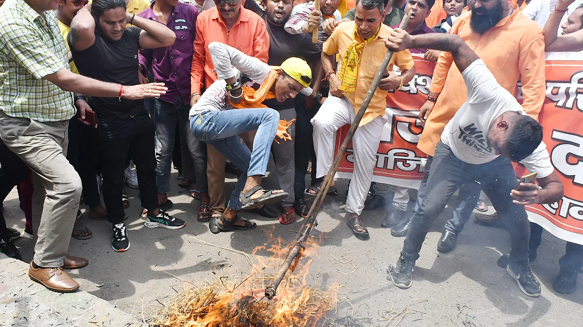 Bajrang Dal and VHP workers held 'demonstrations' across  Delhi NCR after the July violence in Nuh, Haryana. This image from 2 August shows an effigy of Islam being burnt and stomped on in Ghaziabad (photo: Sakib Ali/Hindustan Times via Getty Images)