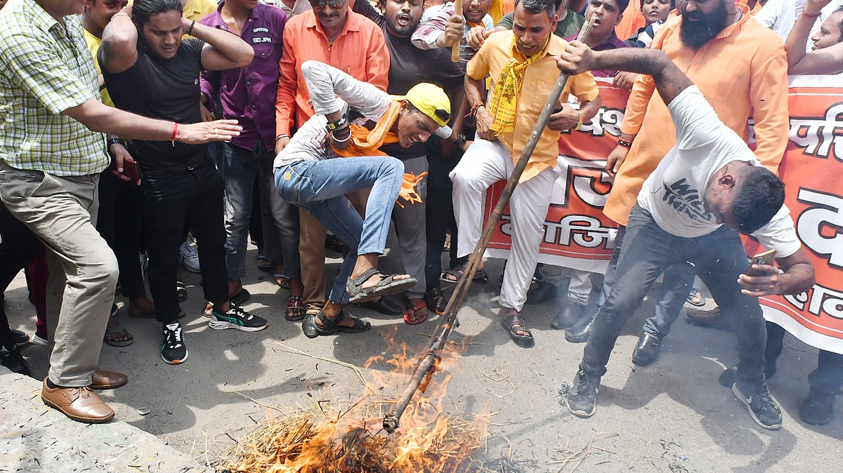 Bajrang Dal and VHP workers held 'demonstrations' across  Delhi NCR after the July violence in Nuh, Haryana. This image from 2 August shows an effigy of Islam being burnt and stomped on in Ghaziabad (photo: Sakib Ali/Hindustan Times via Getty Images)