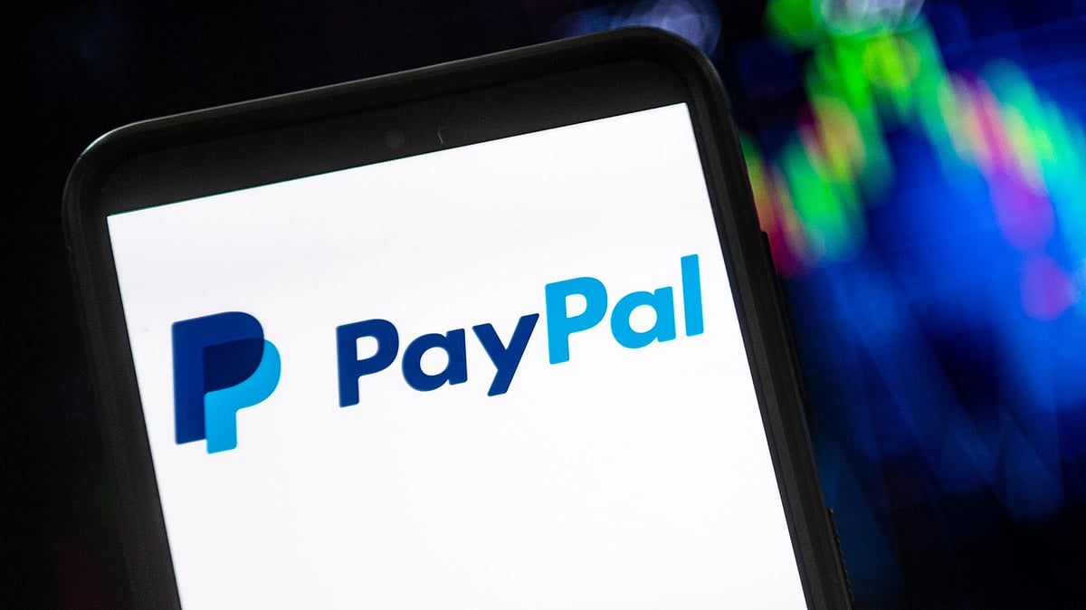 In this photo illustration a PayPal logo seen displayed on a smartphone (Photo: Getty Images)