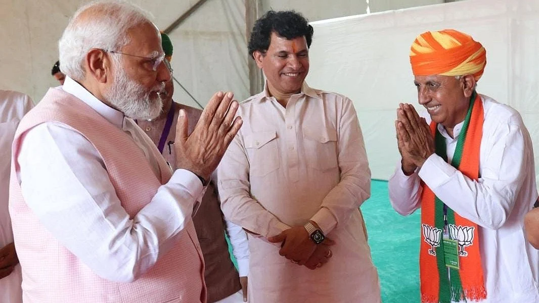 Ajmer BJP Bhagirath Choudhary (left) greets PM Narendra Modi (photo courtesy: @mpbhagirathbjp/Twitter)
