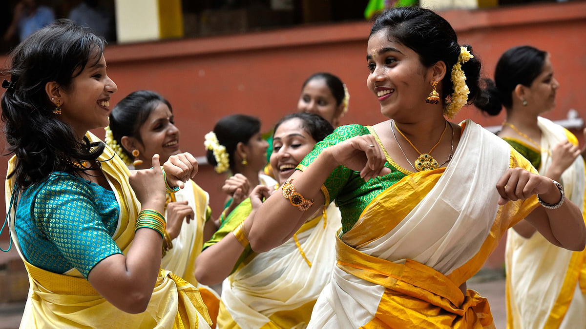 Students celebrate Onam by performing "Kaikotukali" (Clapping dance) in a quadrangle  (Photo: Getty Images)