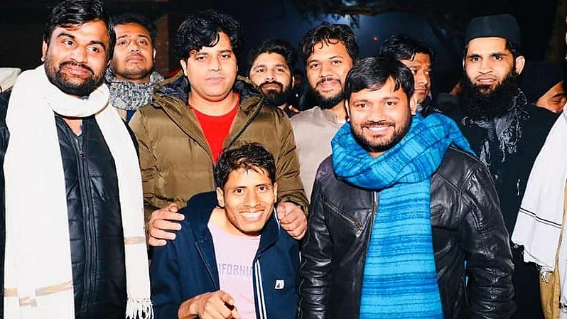 Farooque Alam (left of centre, pink t-shirt) with NSUI national president Kanhaiya Kumar (blue scarf) and Rajya Sabha MP Imran Pratapgarhi (olive jacket, behind Alam) (photo courtesy @farooque.alam.3572/Facebook)
