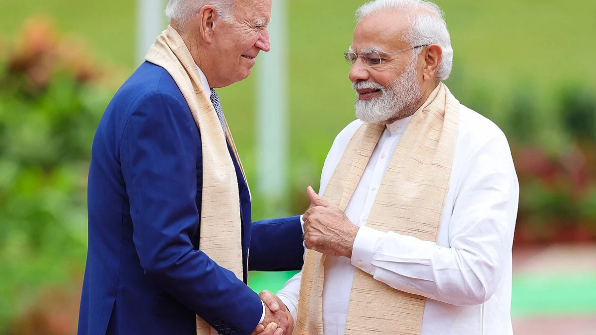 Prime Minister Narendra Modi (right) with US president Joe Biden during a visit to pay homage at Mahatma Gandhi's memorial Rajghat on the final day of the G20 Summit, in New Delhi, on Sunday, 10 September 2023 (photo: IANS/PIB)