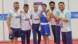 Boxing champion Nikhat Zareen (centre) with others from the Indian boxing contingent at the Asian Games (photo: IANS)