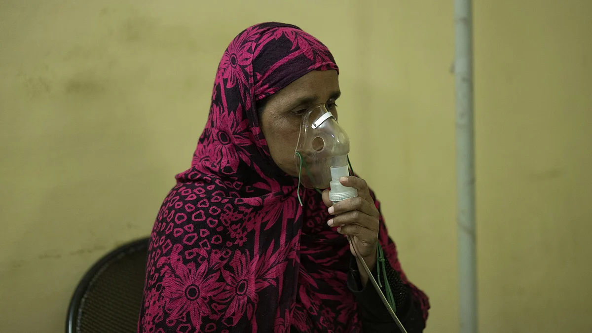 Representative image of a woman using an oxygen mask to aid her breathing (photo: Getty Images)