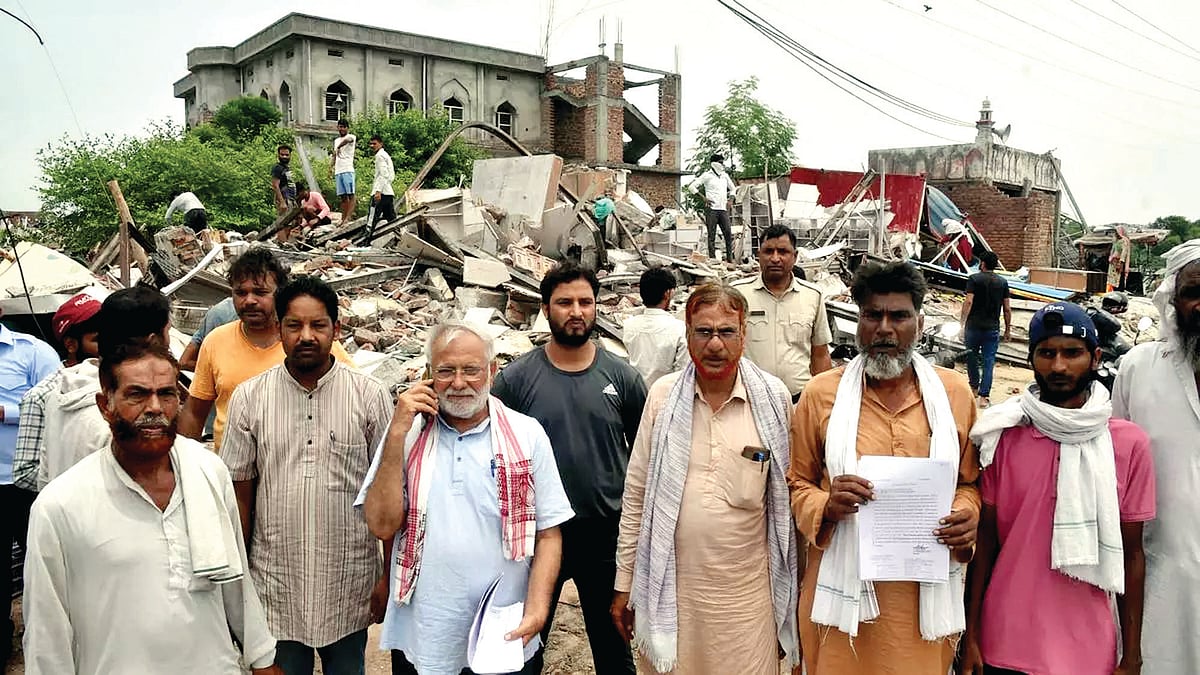 Shop owners in Haryana's Nuh show their documents shortly after their properties were razed by the administration for allegedly being 'illegal constructions', 5 August 2023 (Photo courtesy: Sushil Kumar Verma/ Frontline