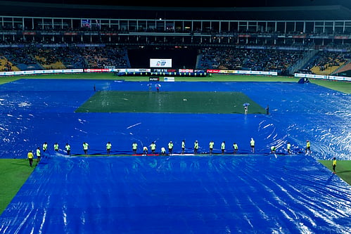 The Pallekele stadium ground being covered amid rains on Saturday (Photo: IANS)