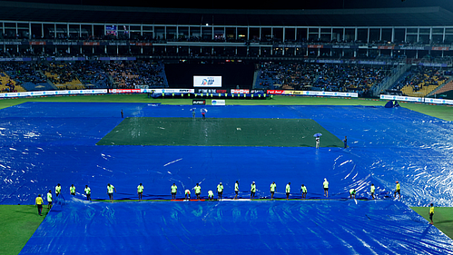 The Pallekele stadium ground being covered amid rains on Saturday (Photo: IANS)