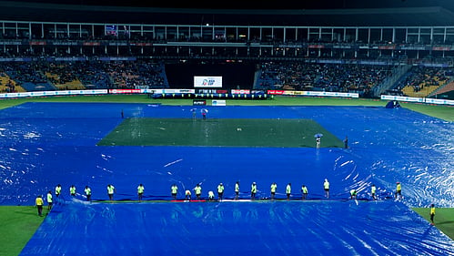 The Pallekele stadium ground being covered amid rains on Saturday (Photo: IANS)