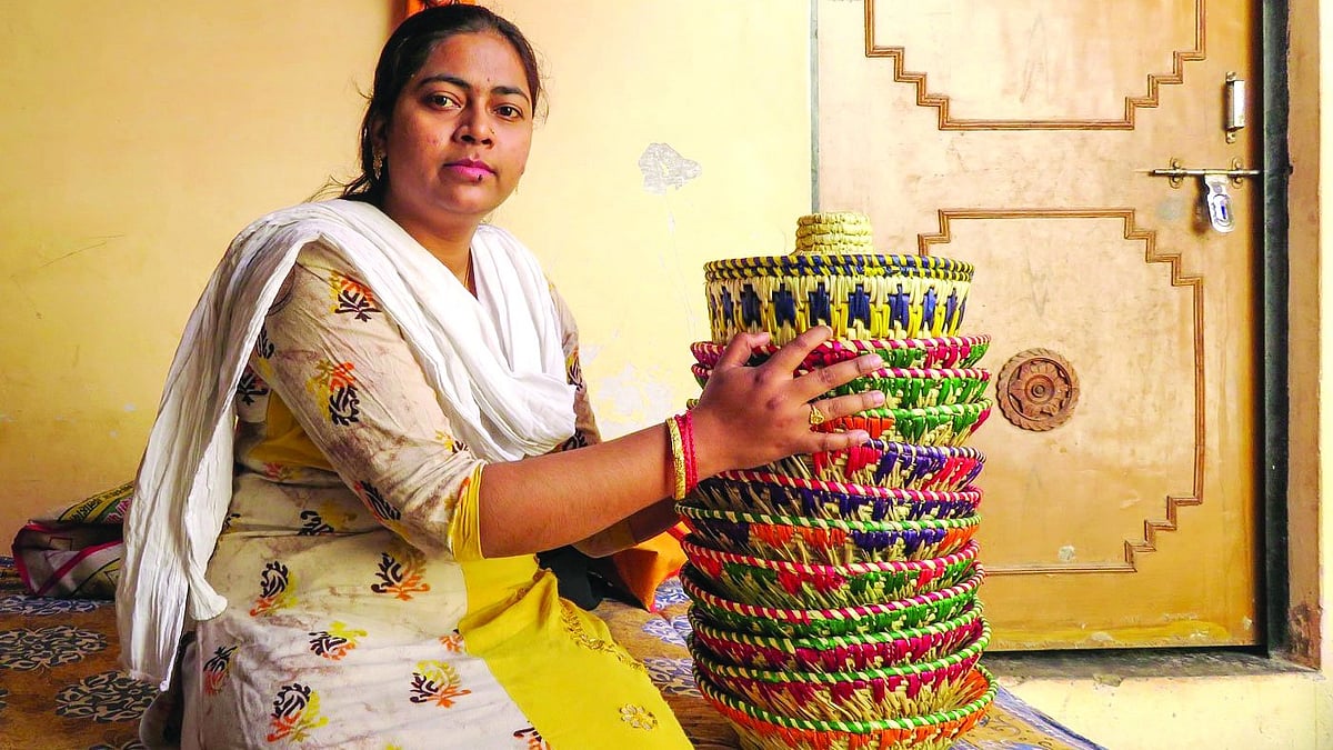 Fatima with an array of finished baskets