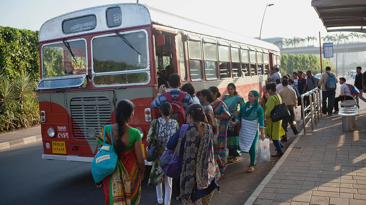 Representative image of women boarding buses in the capital city of New Delhi (photo: Getty Images)