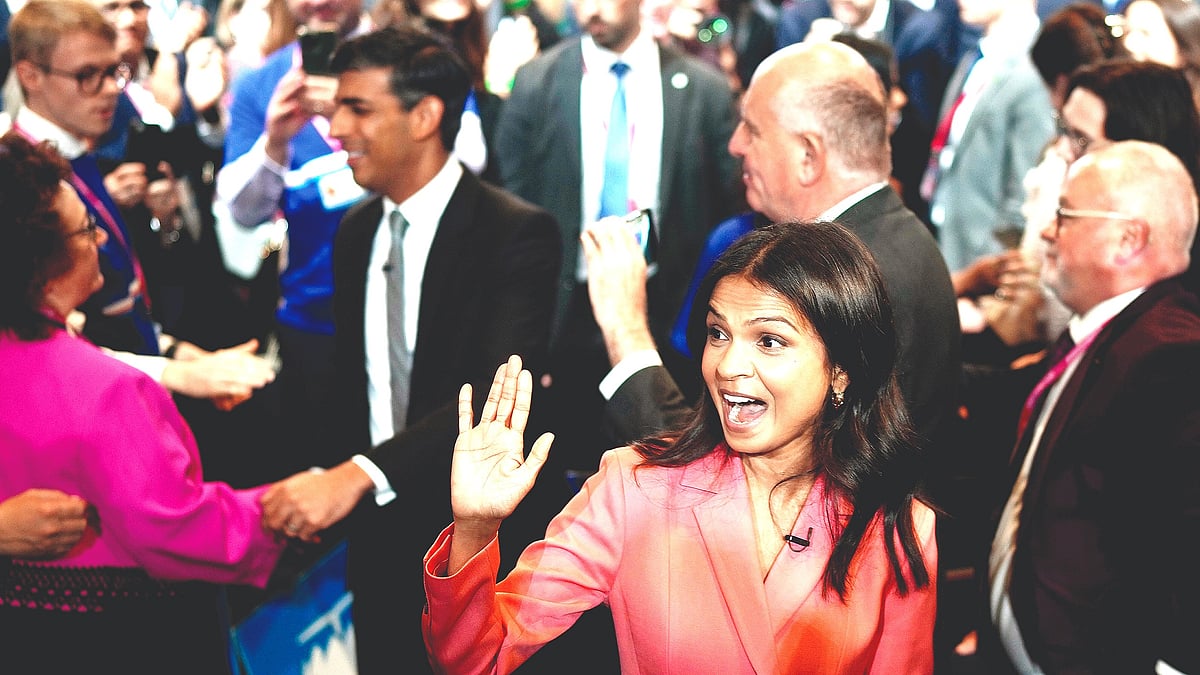 British Prime Minister Rishi Sunak (background) and wife Akshata Murty at the Conservative Party conference on 4 Oct in Manchester, England. (Photo: Getty Images)